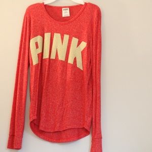 red long sleeve tee from pink, has gold letters